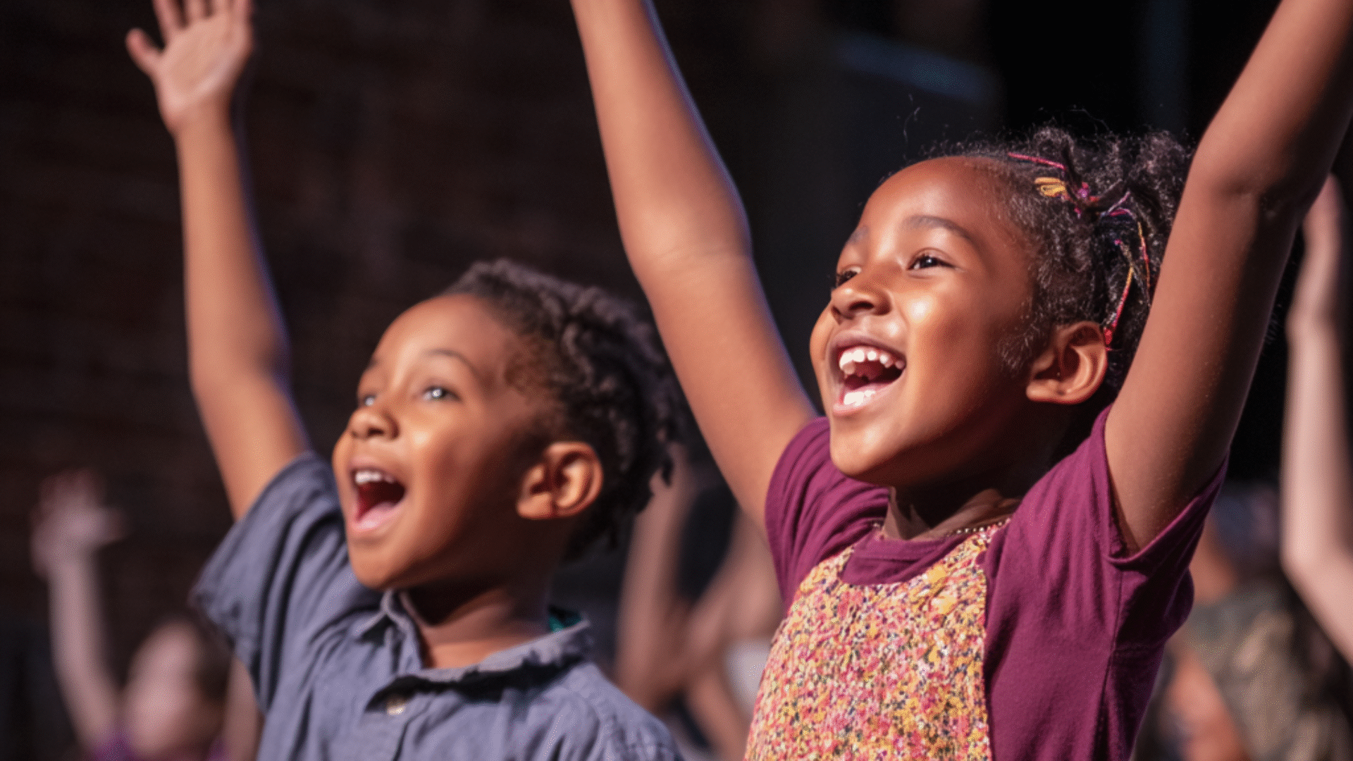 nalhall_happy_black_and_brown_children_on_stage_acting_in_a_t_000b0911-ab28-4b8c-be13-16ae42eba9e3_2